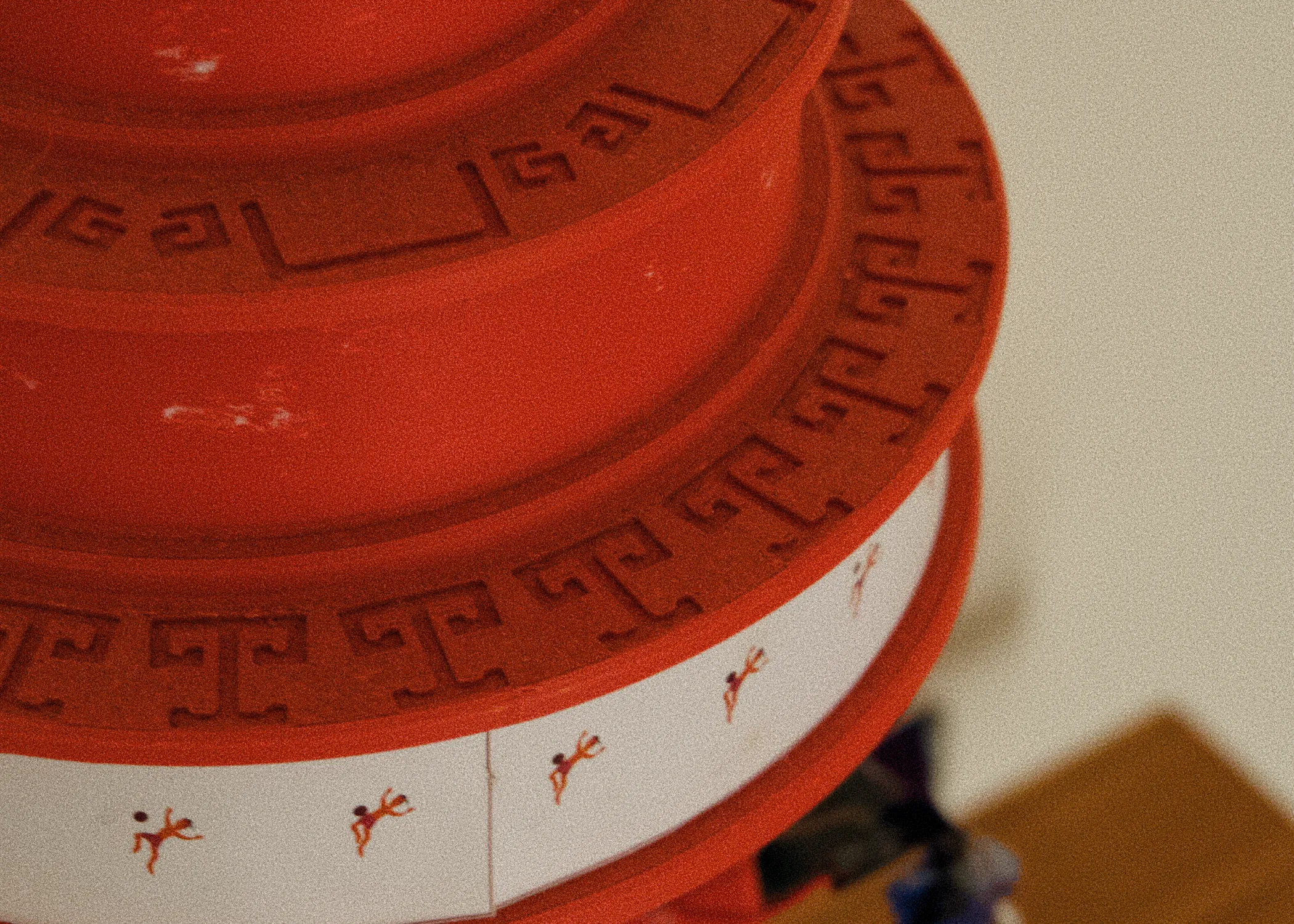 Reduced-scale prototype — carved pattern and printed figure strip detail