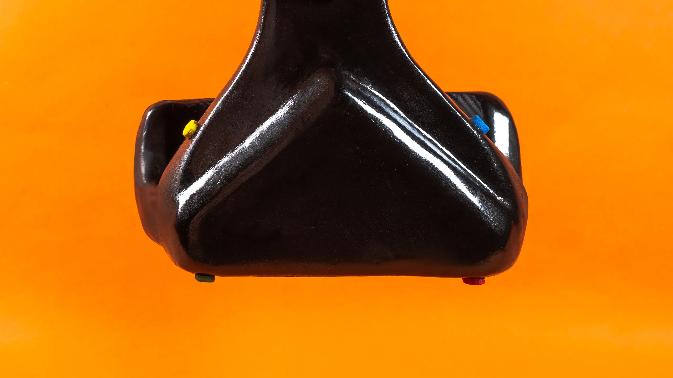Proxima — lower grip and handle detail, colored buttons
