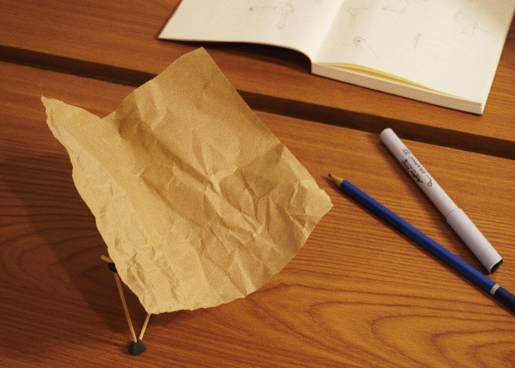 Early mock-up &mdash; paper and toothpick study on the desk