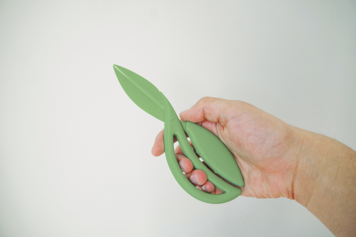 Vida Scissors — PLA prototype held